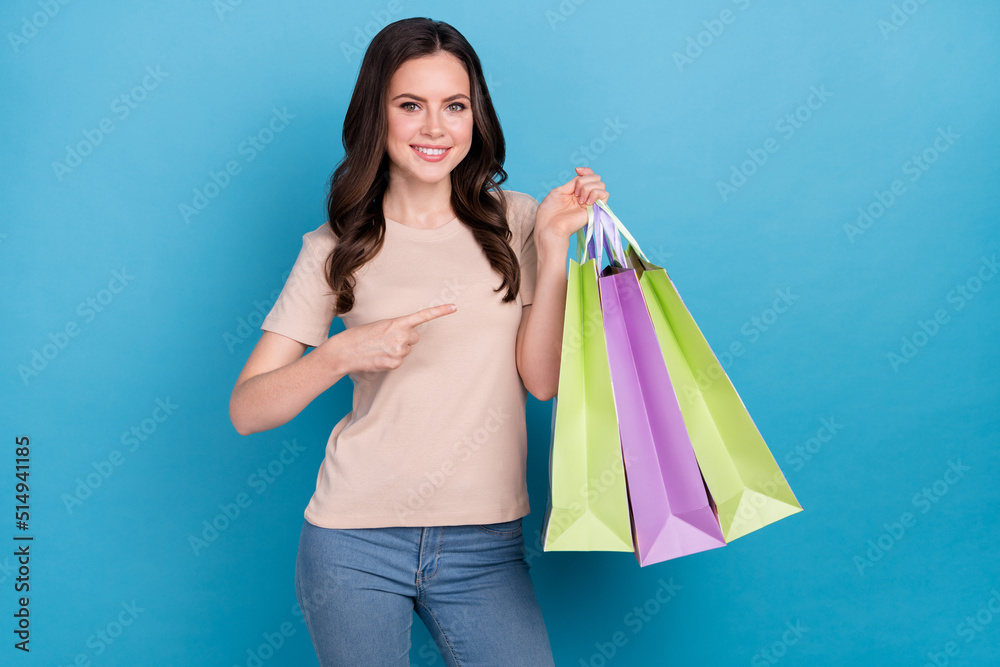 Photo of lady shopping center client hold packages offer special discounts wear jeans isolated blue color background