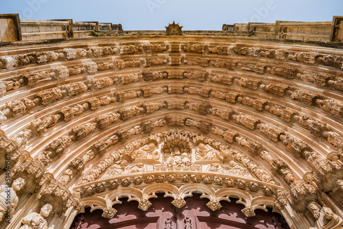 Perspective of archivolts and tympanum with derocative religious figures from the entrance portal of the Monastery of Santa Maria da Vitória, Batalha PORTUGAL photo