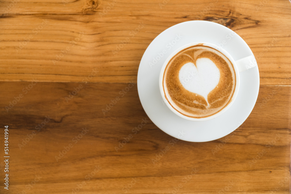 coffee cup on wood table background,Hot latte coffee with latte art coffee cup on wood table background,Hot latte coffee with latte art
