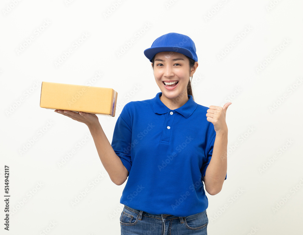 Happy delivery asian woman in blue uniform standing holding parcel cardboard box on isolated white background. Smiling female delivery sending box package service worker. Happy delivery asian woman in blue uniform standing holding parcel cardboard box on isolated white background. Smiling female delivery sending box package service worker.