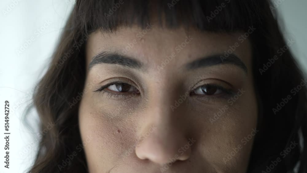 Person opening eyes in meditation smiling. Closeup of one hispanic happy latina woman portrait Person opening eyes in meditation smiling. Closeup of one hispanic happy latina woman portrait