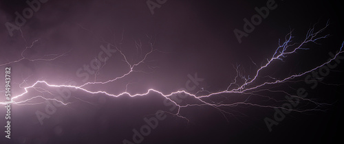 Fotografie, Obraz powerful lightning strikes over the night sky