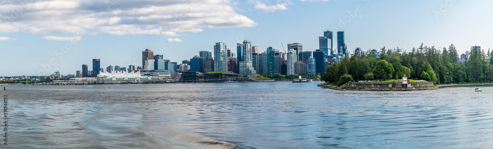 A view from the bay towards Stanley Park and Canada Place in Vancouver, Canada in summertime