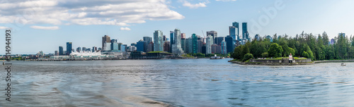 A view from the bay towards Stanley Park and Canada Place in Vancouver, Canada in summertime photo