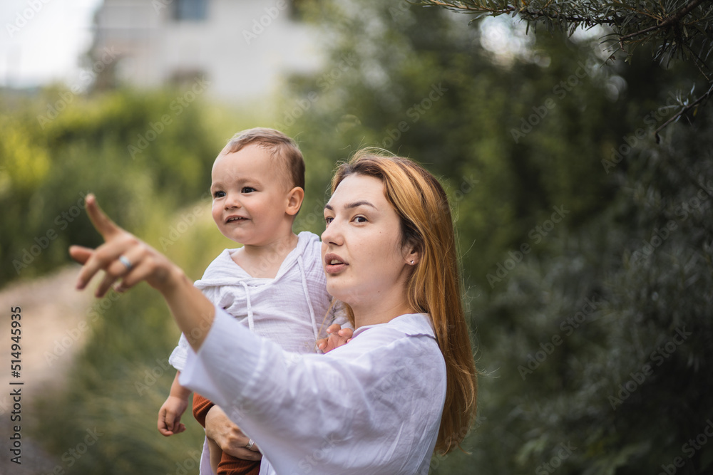 Fototapeta premium Mom spends time with her son. Happy motherhood. Mom and her baby. Smiling mother and her son.