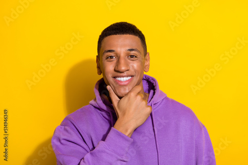 Portrait of attractive minded cheerful brunet guy creating solution overthinking isolated over vivid yellow color background