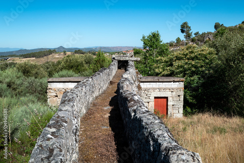 Aqueduto de pedra que servia para levar a água para o moinho mais abaixo para noutros tempos moer os cereais photo