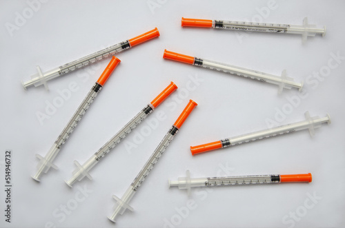 insulin syringes on a light background, medical background with syringes