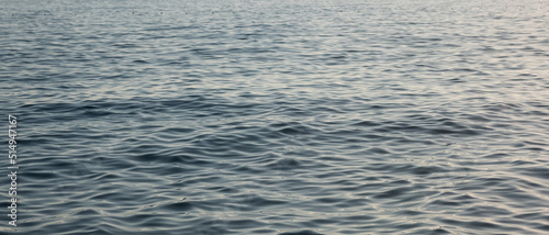 Sea wave close up, low angle view. Abstract sea background, view on ripple surface of water