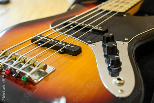 Bass guitar on the stage, close up. Eelectric bass guitar in studio.  Music instrument
