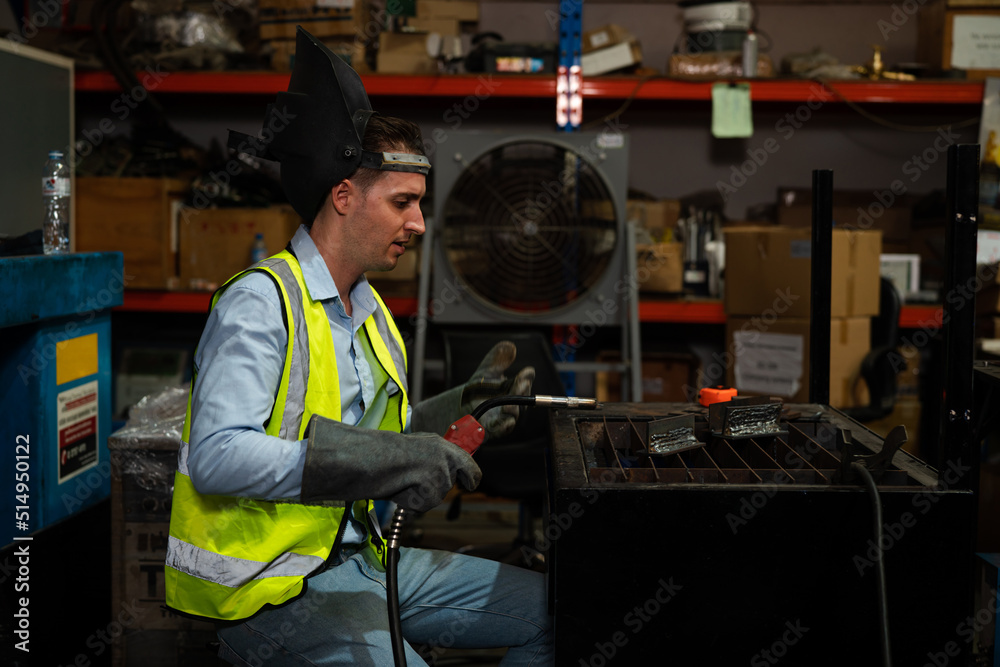 Male technician worker working in the factory, Welder is working to weld metal. Male technician worker working in the factory, Welder is working to weld metal.