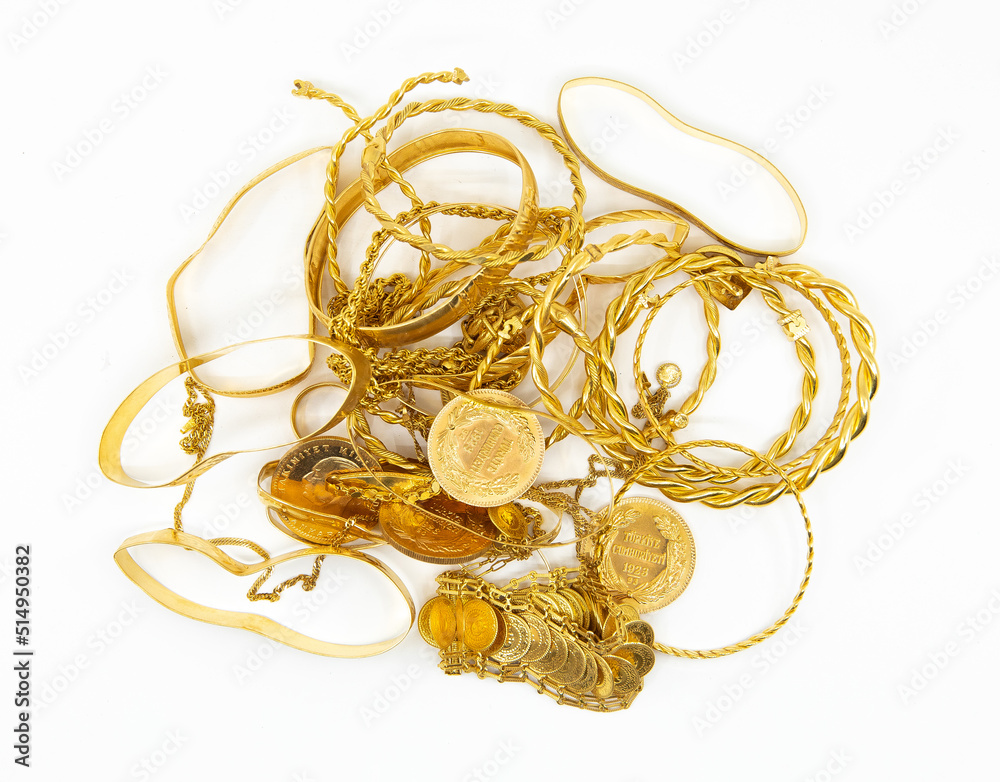 Heap or stack of variety traditional Turkish scrap gold and coins isolated on white background.