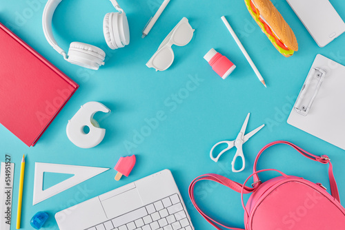 Creative flat lay with school supplies on pastel blue background. Border arrangement. Back to school minimal concept. photo