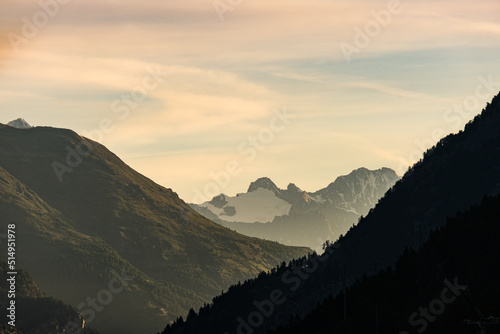 Sunrise picture with noise effect of mountain and cloud at Täusch, Switzerland.