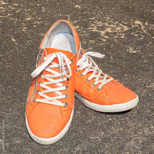 Orange womens casual sports shoes..