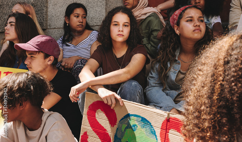 Diverse youth activists holding a climate change demonstration