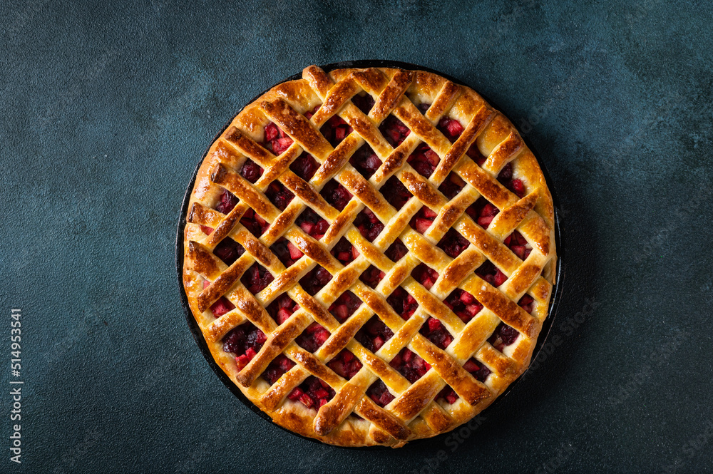 Delicious Homemade Cherry Pie with a Flaky Crust on dark background. Top view. American pie. Cherry dessert. Flatlay Delicious Homemade Cherry Pie with a Flaky Crust on dark background. Top view. American pie. Cherry dessert. Flatlay