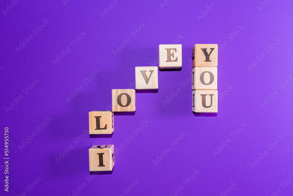 Message I love you spelled in wooden blocks with copy space,Purple,veri peri background. Message I love you spelled in wooden blocks with copy space,Purple,veri peri background.