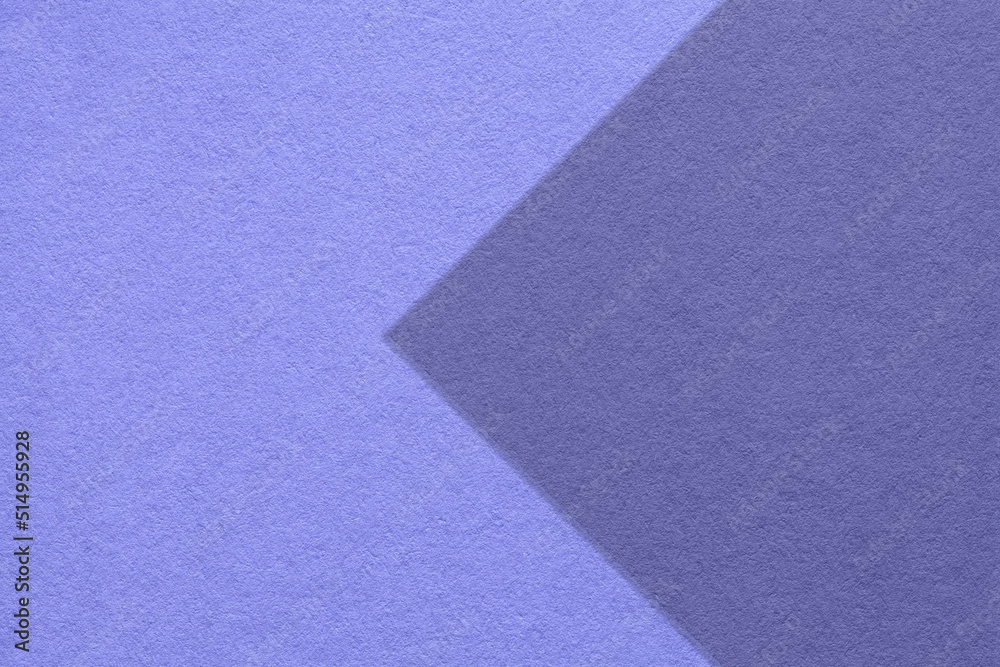 Texture of violet and blue paper background, half two colors with arrow, macro. Structure of craft very peri cardboard. Texture of violet and blue paper background, half two colors with arrow, macro. Structure of craft very peri cardboard.