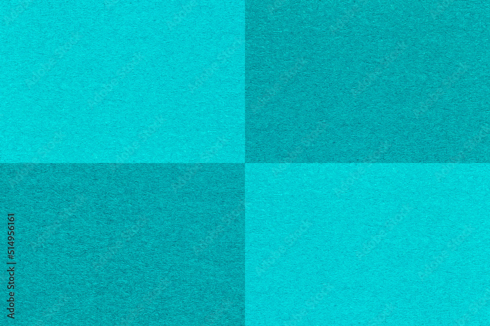 Fototapeta premium Texture of craft cyan and cerulean paper background with cells pattern, macro. Structure of vintage turquoise cardboard.