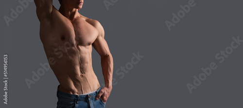Fotografie Fit guy with six pack abs torso pose shirtless grey background, muscle