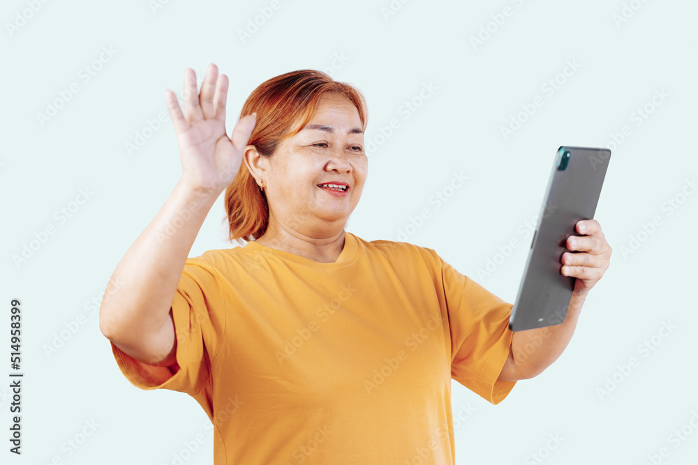 Old woman using smart tablet technology and digital life. Old woman using smart tablet technology and digital life.