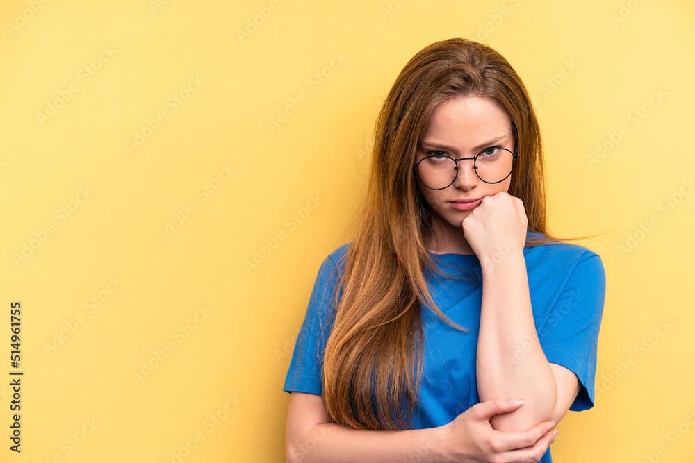 Young caucasian woman isolated on yellow background who feels sad and pensive, looking at copy space.