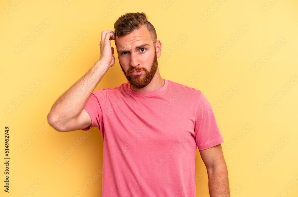 Young caucasian man isolated on yellow background tired and very sleepy keeping hand on head. Young caucasian man isolated on yellow background tired and very sleepy keeping hand on head.
