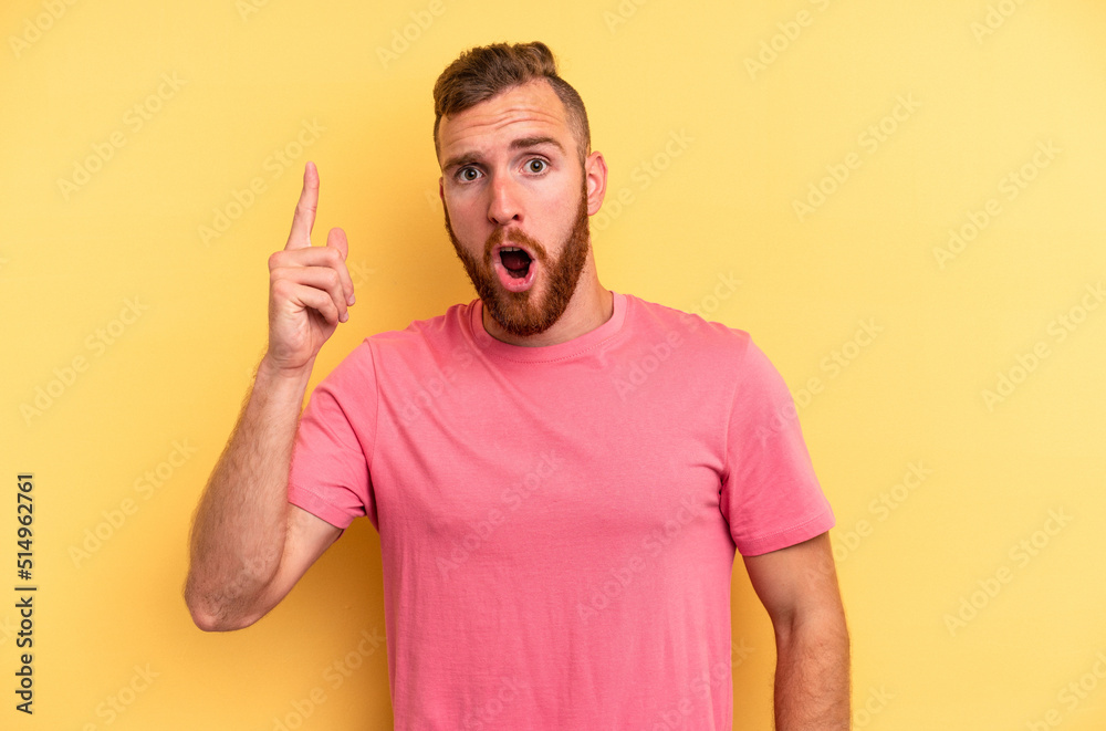 Young caucasian man isolated on yellow background having an idea, inspiration concept. Young caucasian man isolated on yellow background having an idea, inspiration concept.