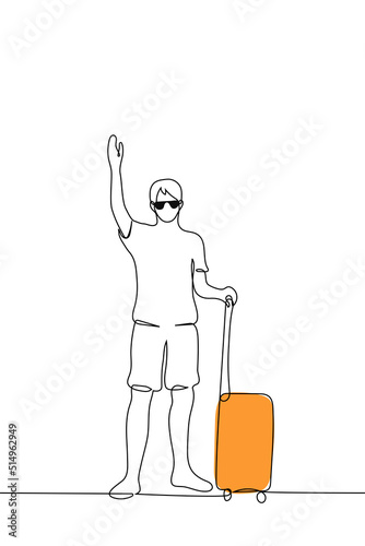 man stands and waves his hand and holds a suitcase on wheels - one line drawing vector. concept tourist waving to a transfer greeter, farewell or meeting a foreigner