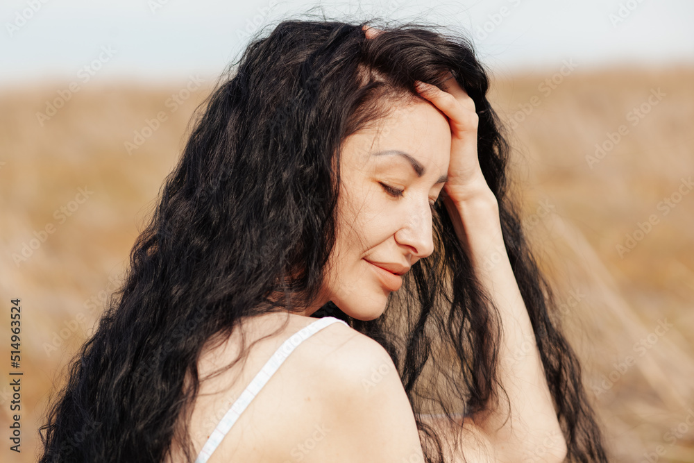 Beautiful woman in a field.   