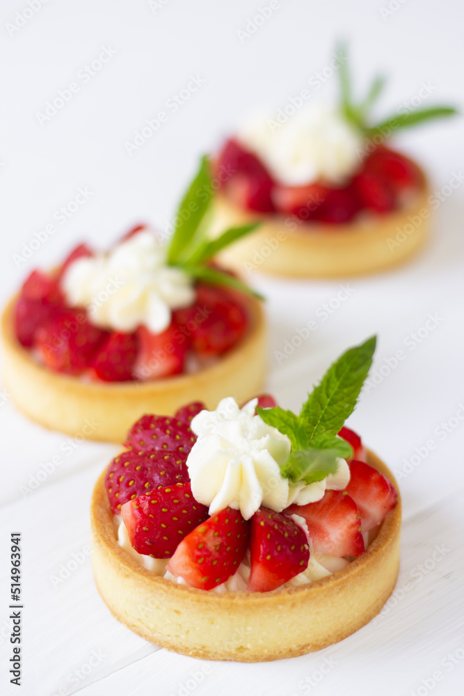 Mini tarts with fresh strawberries, wiped cream and mint leaves. Strawberry tarts Mini tarts with fresh strawberries, wiped cream and mint leaves. Strawberry tarts