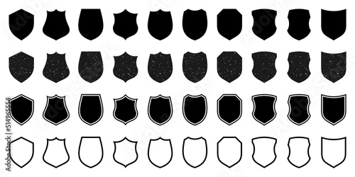 Set of various vintage outlined shield icons. Black heraldic shields with grunge texture. Protection and security symbol, label. Vector illustration.