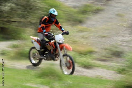 Blurry image of motorcycle riders during motocross race © Kybele