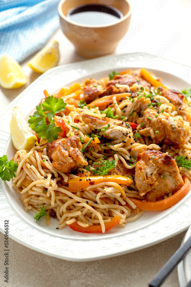 Asian style, stir fry noodles with chicken meat and vegetable, dark background. homemade food Asian style, stir fry noodles with chicken meat and vegetable, dark background. homemade food