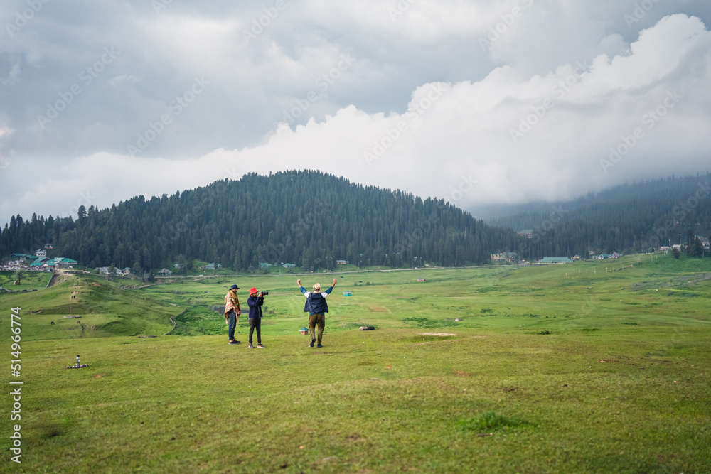 3 friends in the mountains, and photo depicts the peace and heavenly beauty that prevails in the valley of Kashmir which has been engulfed by the terrorism, Gulmarg, Kashmir, India.