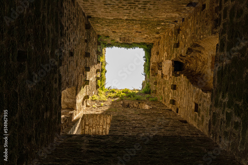 view from ground to sky in the old tower of the castle ruins in Momjan in Croatia photo