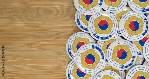 3D rendering of the emblem of the South Korean flag pin on a wooden table for politics, support and nationalism
