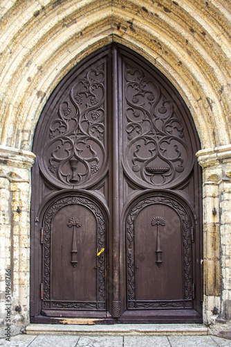 Old wooden door of Church of St Olaf in Tallinn, Estonia photo