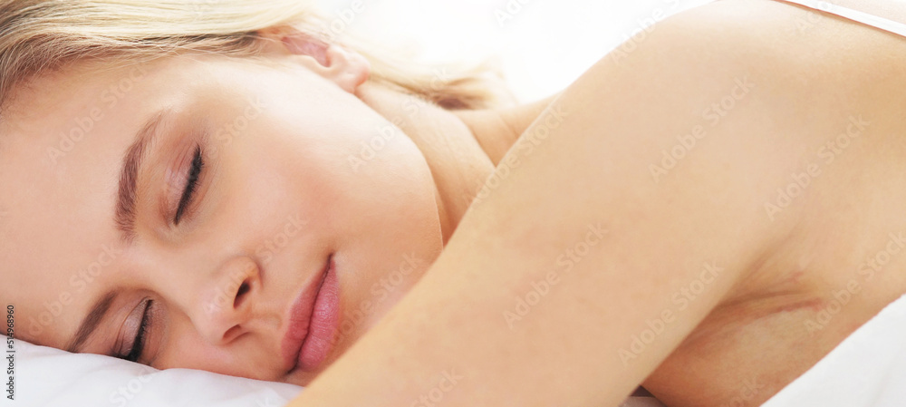 Young and beautiful woman in the bed. Sleeping woman at home in the morning.