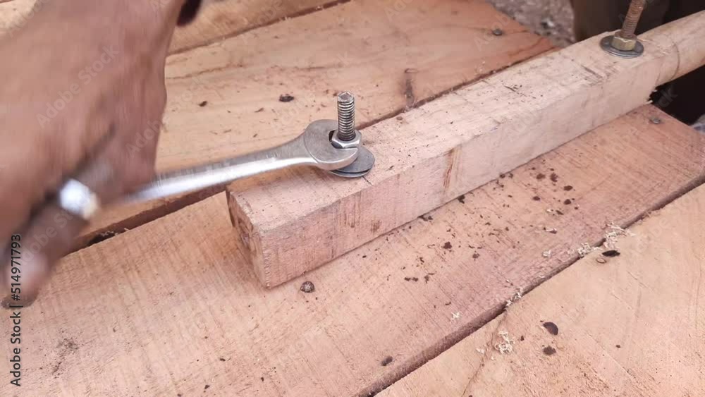 A Carpenter Fixing Handle Of Thela Gadi Wheelbarrow By Nut Bolt Fitting Tools - Nut Bolt Fitting Tools A Carpenter Fixing Handle Of Thela Gadi Wheelbarrow By Nut Bolt Fitting Tools - Nut Bolt Fitting Tools