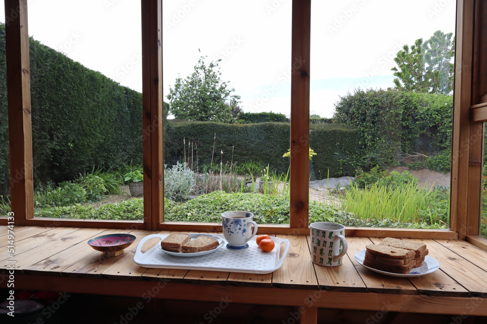 Fototapeta premium A lunchtime snack in a garden shed during a welcome break from work in the garden