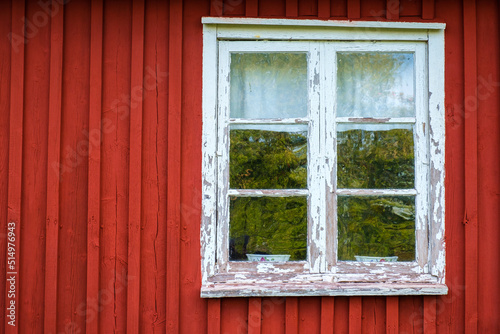 Old wooden cottage with a window