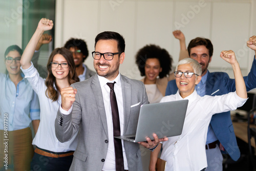 Εκτύπωση καμβά Group of successful multiethnic business people celebrating a good job in the of