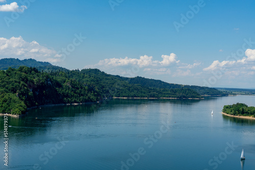 Lake Czorsztynskie and sailing boats on it in the summer noon © Blazej 