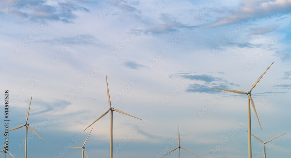 Fototapeta premium Panoramic image Wind turbine generator with blue sky - Energy Conservation Concept Thailand