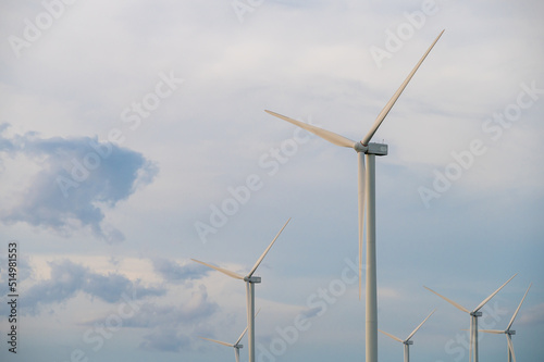 Wind turbine generator with blue sky - energy conservation concept. thailand
