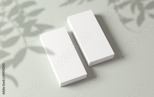 Stacks of flyers mockup blank paper for design presentation. White empty leaflet template with plant shadow on the background in 3D illustration. Stationery concept