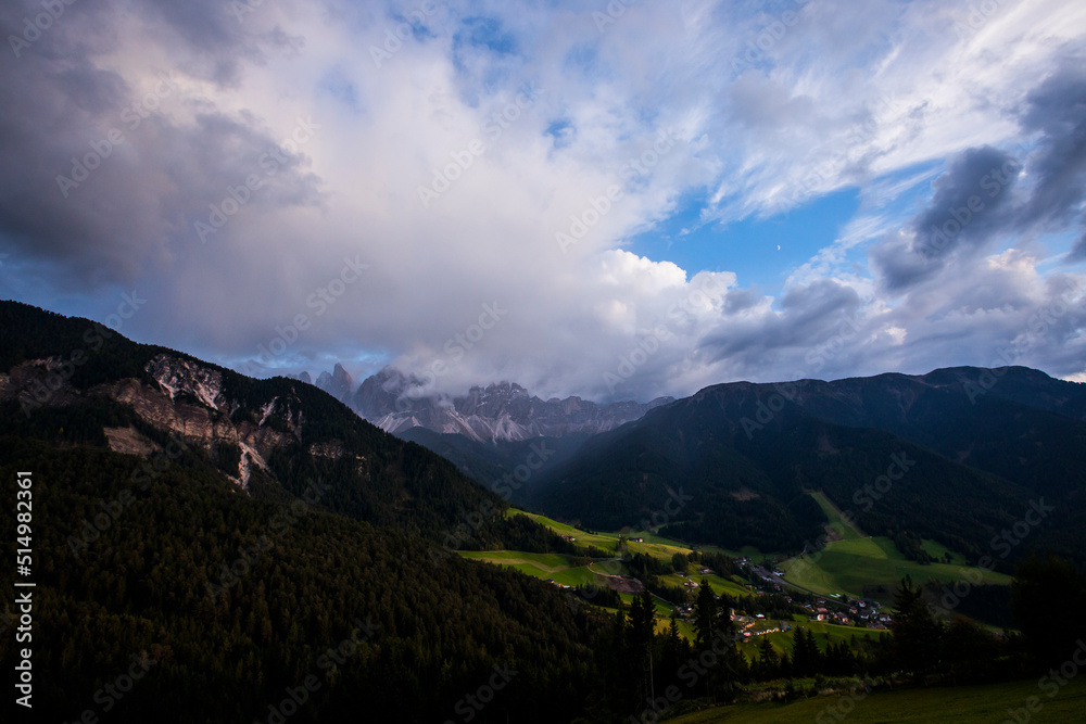 Fototapeta premium Sunset and rainbow in Val Di Funes, Dolomites, Alps, Italy