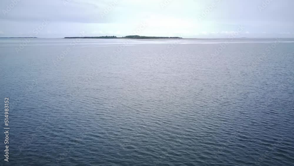drone flight over the island in the sea . forest drone flight over the island in the sea . forest